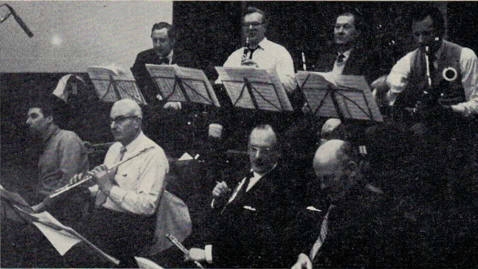 First-call London studio musicians recording with Quincy Jones, Henry Mancini and conductor Bob Farnon in April 1964; back row (left to right): Frank Reidy, Bob Burns (clarinet), Cecil James, Anthony Judd (bassoons); front row: Johnny Scott, Phil Goody, Geoffrey Gilbert (flutes), Leon Goossens (oboe). Photo courtesy of National Jazz Archive, Great Britain