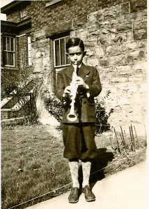 A young Rubin poses with his metal clarinet