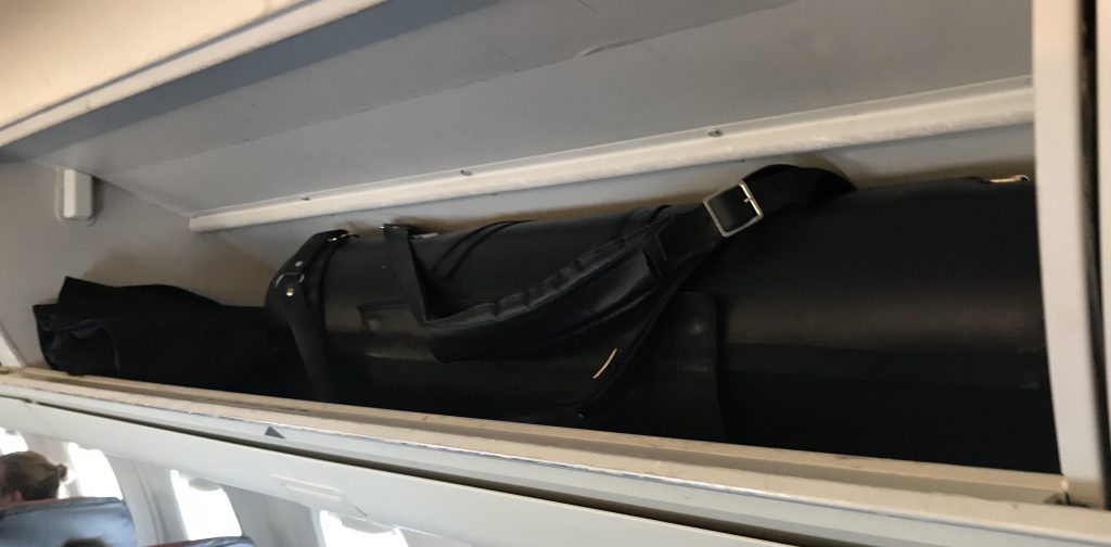 Wiseman Model A bass clarinet case in the overhead bin of the small Embraer 145 Canadian regional jet (American Airlines)